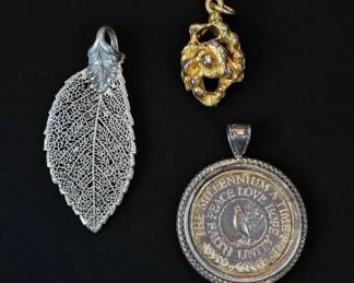 Assorted Vintage Pendant Collection Millennium Coin, Organic Goldtone, and Filigree Leaf