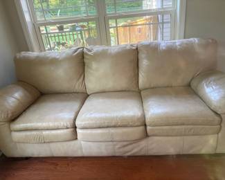 Cream colored sofa bed / minor scratching on arms
