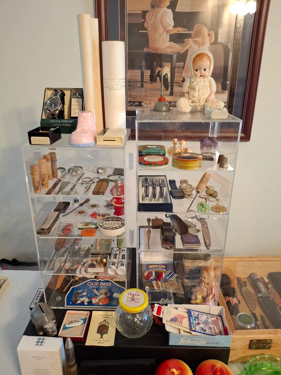 Wide Variety of Goodies in the Showcases Including: 2 Waterford Pen Sets, Military Medals, Ice Pick, Metal Banks, and Much More!