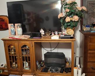 55in LG T.V., Oak Entertainment Center, Lots of 80s and 90s Posters, and Dolls in Boxes!
