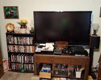Antique Writing Table and 55in Sharp T.V. Also Nascar Magazines, Nascar Race Ticket Stubs, Binoculars and More Radko Ornaments!