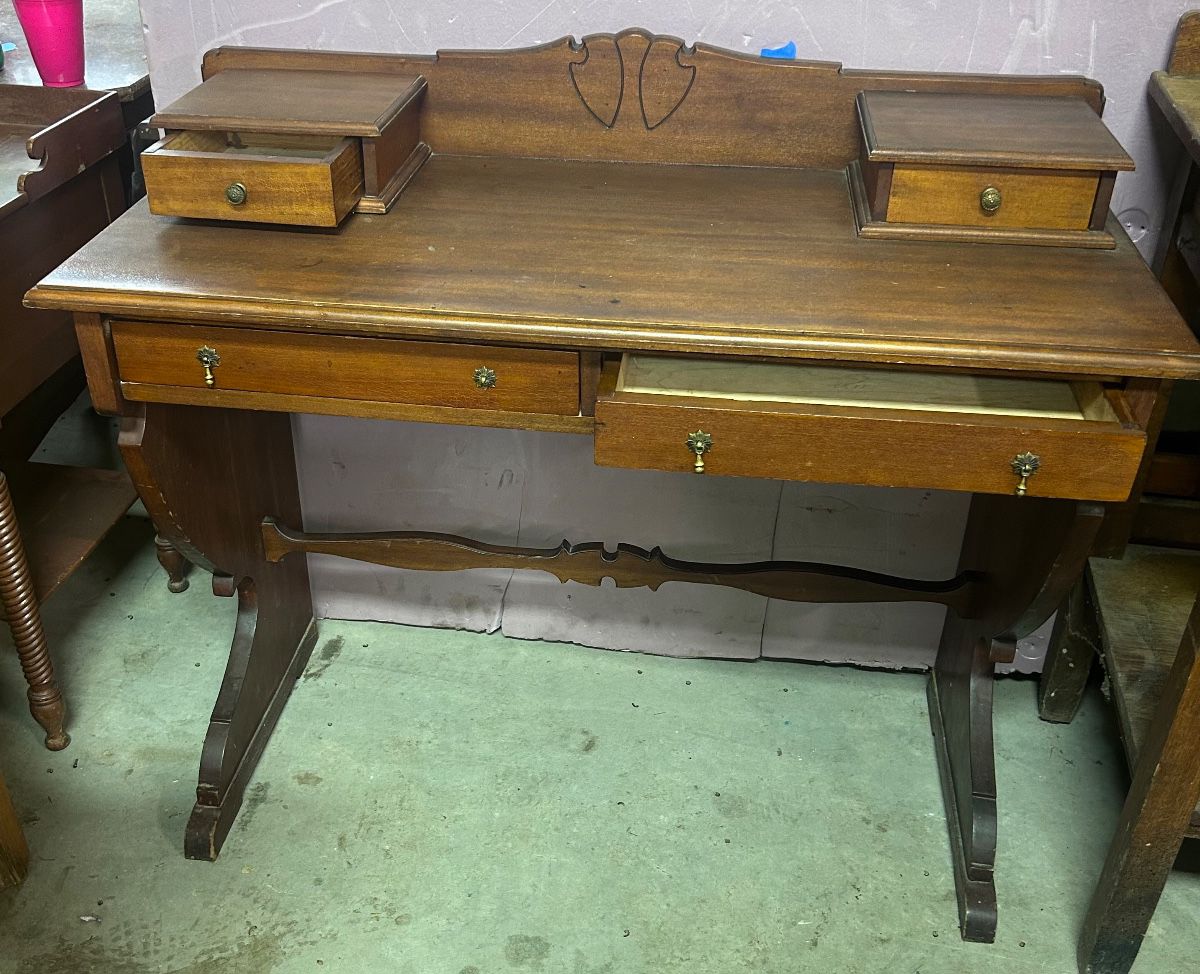 Writing desk with stepped top with two drawers and two small drawers on top