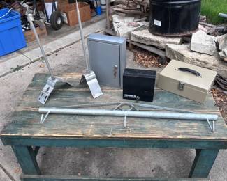 Couple of roof lightning rods with bracket, a Midwest Air Tech Fenve stretcher bar,  along with some $$$ boxes. 