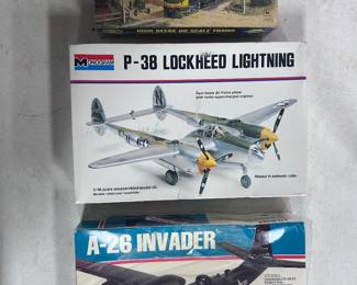 Athearns John Deere HO size locomotive still in original box and shrink wrapped. And two other military plane models still in their boxes.