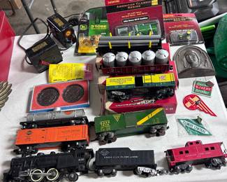 John Deere toys in blister packs, Gilbert American Flyer train and accessories Charles Lindberg book end railroad patches, G M coasters.