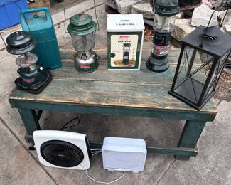 Various lanterns, garden light holder, and a couple of fans.
