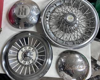 Various hubcaps: including IHand a Jotsclaw boat trailer hubcap.