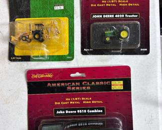 John Deere farm implement booster packs by Ertl.