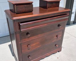 American Empire flame mahogany dresser with key. NOTE the partially opened secret top drawer.