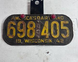 A 1942 license plate w/ reflectors AND a (very hard to find) 1943 revalidation tab.