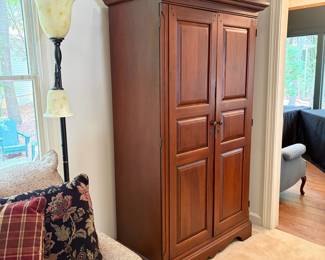 F32 - $125. Armoire. Measures 44.75" wide, 23.5" deep, 76.25" tall. Has been used for linen storage. In very good condition.