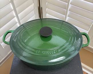 F43 - $100. Oval Le Creuset Dutch Oven #31. Has been used and has some signs of wear. Enamel doesn't have any chips - just signs of use.
