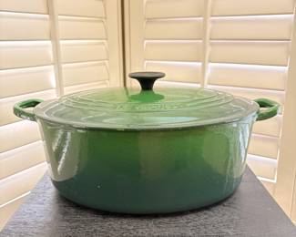 F43 - $100. Oval Le Creuset Dutch Oven #31. Has been used and has some signs of wear. Enamel doesn't have any chips - just signs of use.