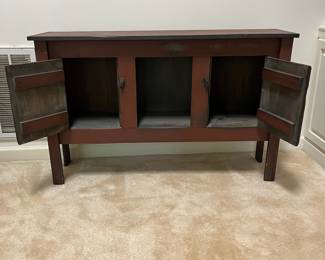 F16 - $150. Console Table. Center is open and both sides open for stdorage. Measures 51.5" x 14" deep x 32.5" tall.