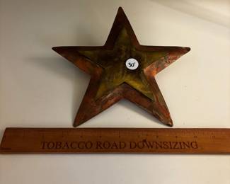 F94 - $30. Copper Star - maybe a tree topper? Has big loop on the back.