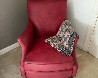 F23 - $30. Red Leather Chair. Measures 28" wide, 40" deep, 35" tall. Well worn, with cracking leather, but still useable.