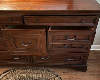 F35 - $275. Aspen Home Dresser with Mirror. Measures 66" wide, 20" deep, 80.5" with mirror. All drawers slide and it's in very good condition.