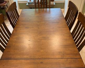 F1 - $450. Dining Table + 6 Chairs with 2 Butterfly Leaves. Table is 63.5" x 38" x 29" tall. Each leaf adds an additional 18". Table + Chairs are in excellent condition. Chairs are 19" wide x 20" deep x 40.5" tall. Floor to Seat is 19.5".