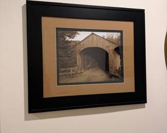 F64 - $20. Framed Photo of a Covered Bridge. Measures 25" x 21".