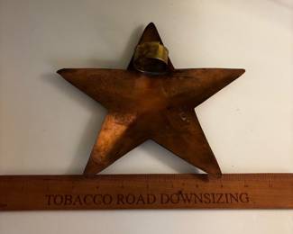 F94 - $30. Copper Star - maybe a tree topper? Has big loop on the back.