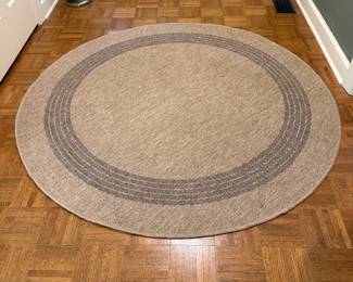 F57 - $40. Origin21 Jute/Black Rug. 61" round. Was used under a kitchen table. Clean, no issues.