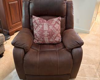 F12 - $400. Ashley Furniture Power Recliner with remote. Brown. Adjustable Lumbar and Headrest. Measures 36" wide x 37" deep x 42.5" tall.