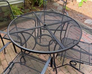 F62 - $250. Iron Patio Table with 4 Bouncing Chairs. Overall in very good condition - very sturdy. Small spots of surface rust.