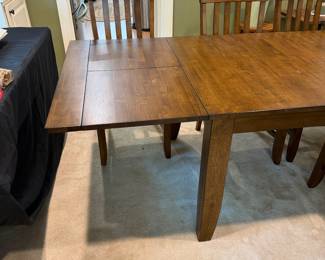 F1 - $450. Dining Table + 6 Chairs with 2 Butterfly Leaves. Table is 63.5" x 38" x 29" tall. Each leaf adds an additional 18". Table + Chairs are in excellent condition. Chairs are 19" wide x 20" deep x 40.5" tall. Floor to Seat is 19.5".