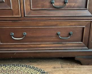 F35 - $275. Aspen Home Dresser with Mirror. Measures 66" wide, 20" deep, 80.5" with mirror. All drawers slide and it's in very good condition.