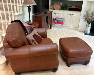 F4 - $795. Robinson & Robinson Leather Chair & Ottoman with antiqued nailhead trim. Both pieces are in excellent condition. Very comfortable!Chair measures 44" x 36" x 36.5" tall. Floor to seat is 19". Ottoman measures 29" wide x 25.5" deep x 17" tall.
