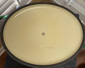 F43 - $100. Oval Le Creuset Dutch Oven #31. Has been used and has some signs of wear. Enamel doesn't have any chips - just signs of use.