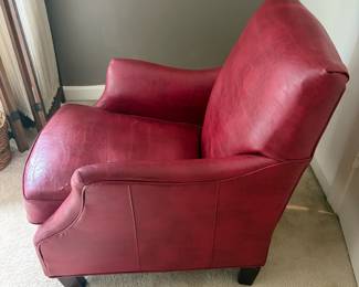 F23 - $30. Red Leather Chair. Measures 28" wide, 40" deep, 35" tall. Well worn, with cracking leather, but still useable.