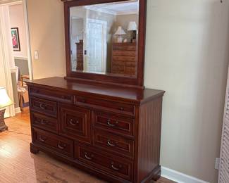 F35 - $275. Aspen Home Dresser with Mirror. Measures 66" wide, 20" deep, 80.5" with mirror. All drawers slide and it's in very good condition.