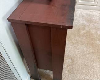 F16 - $150. Console Table. Center is open and both sides open for stdorage. Measures 51.5" x 14" deep x 32.5" tall.