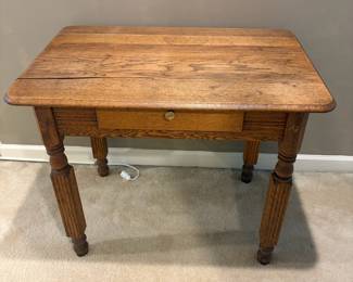 F22 - $85. Antique Wooden table/Desk with single drawer. Measures 36.5" wide x 24" deep x 29" tall.