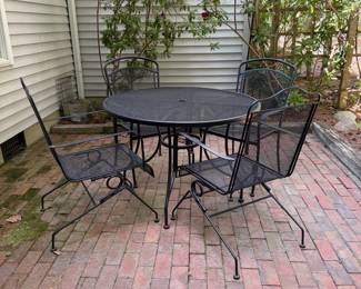 F62 - $250. Iron Patio Table with 4 Bouncing Chairs. Overall in very good condition - very sturdy. Small spots of surface rust.