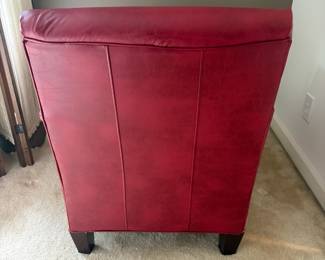 F23 - $30. Red Leather Chair. Measures 28" wide, 40" deep, 35" tall. Well worn, with cracking leather, but still useable.