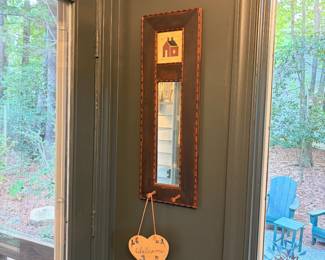 F10 - $20. Framed mirror with hooks. Measures 10" wide, 31" tall, 3" deep at hooks.