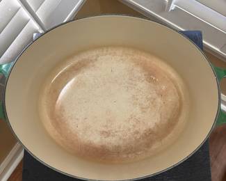 F43 - $100. Oval Le Creuset Dutch Oven #31. Has been used and has some signs of wear. Enamel doesn't have any chips - just signs of use.