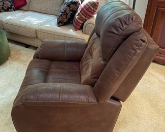 F12 - $400. Ashley Furniture Power Recliner with remote. Brown. Adjustable Lumbar and Headrest. Measures 36" wide x 37" deep x 42.5" tall.