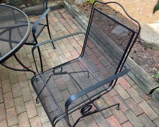 F62 - $250. Iron Patio Table with 4 Bouncing Chairs. Overall in very good condition - very sturdy. Small spots of surface rust.