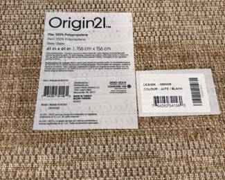 F57 - $40. Origin21 Jute/Black Rug. 61" round. Was used under a kitchen table. Clean, no issues.