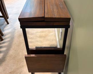 F17 - $30. Small Side Table. Designed to slide under a chair or couch. Measures 12" x 18". With the leaves out it measures 23.75".