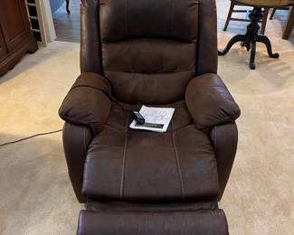 F12 - $400. Ashley Furniture Power Recliner with remote. Brown. Adjustable Lumbar and Headrest. Measures 36" wide x 37" deep x 42.5" tall.