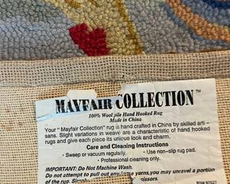 F74 - $60. Mayfair Collection. 100% Wool Hand Hooked Rug. Measures 20.5" x 48.5" long.