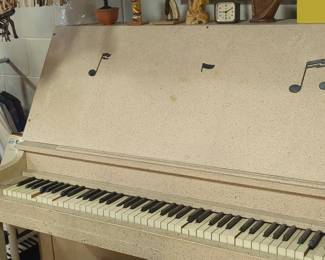 Vintage Spinet Piano with Decorative Musical Notes