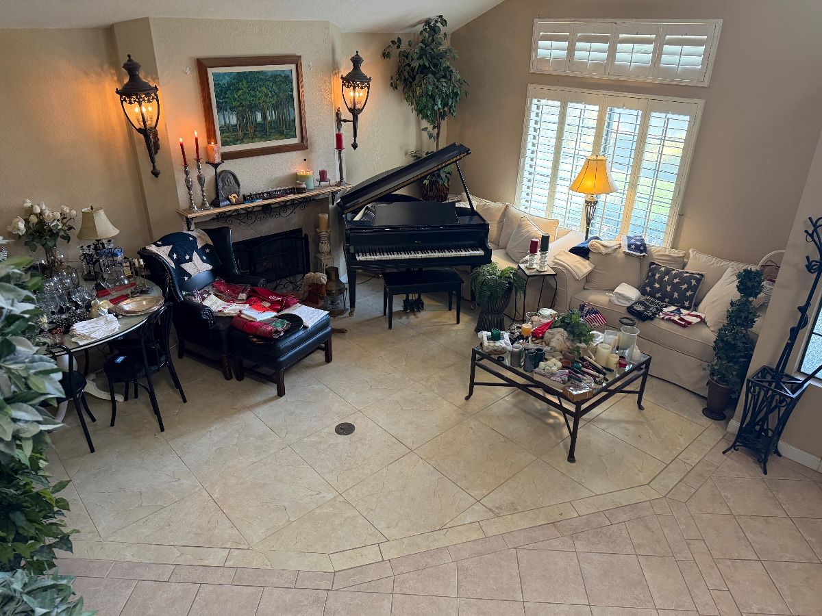 Baby grand piano | Couches | coffee table | leather chair | circular dining room table with glass top (includes another glass top)