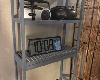 Over the toilet shelf, clock,etc