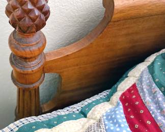Detail of finial on vintage queen bed