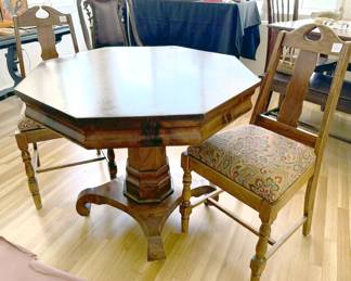 Hexagonal wheeled pedestal table